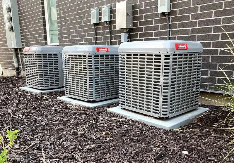 3 AC condenser units along wall