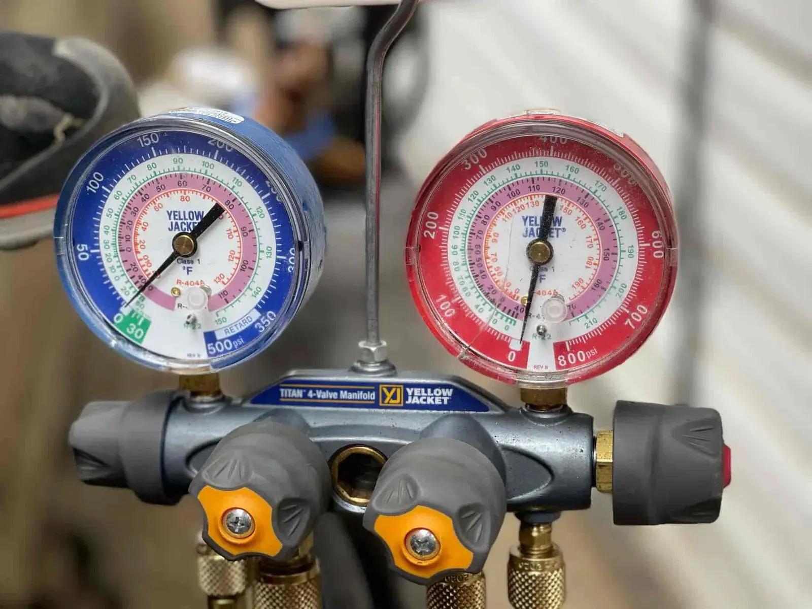 gauges, one blue and one red, measure pressure and temperature