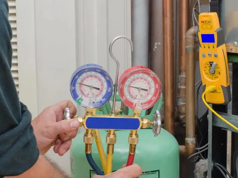 HVAC tech conducting regular maintenance