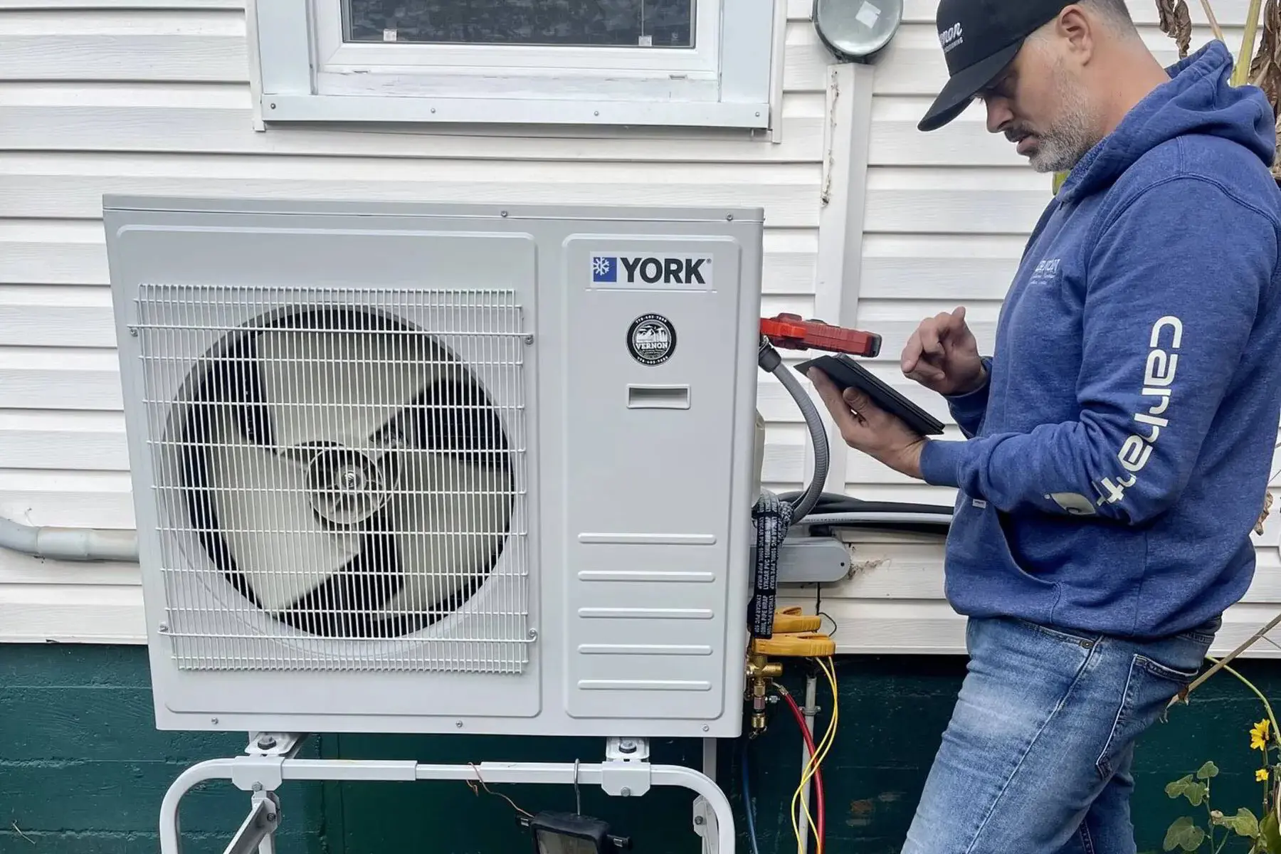 HVAC tech checking refrigerant levels