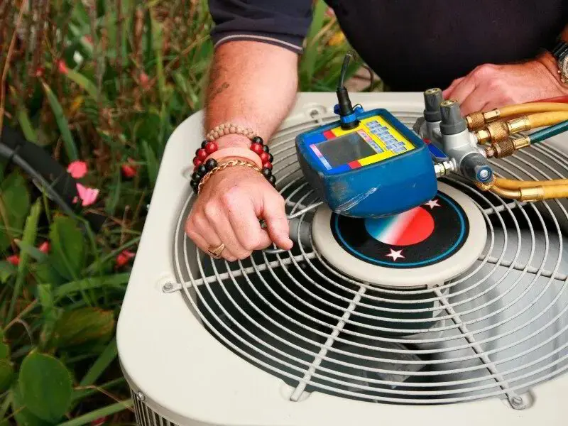 HVAC tech conducting AC maintenance